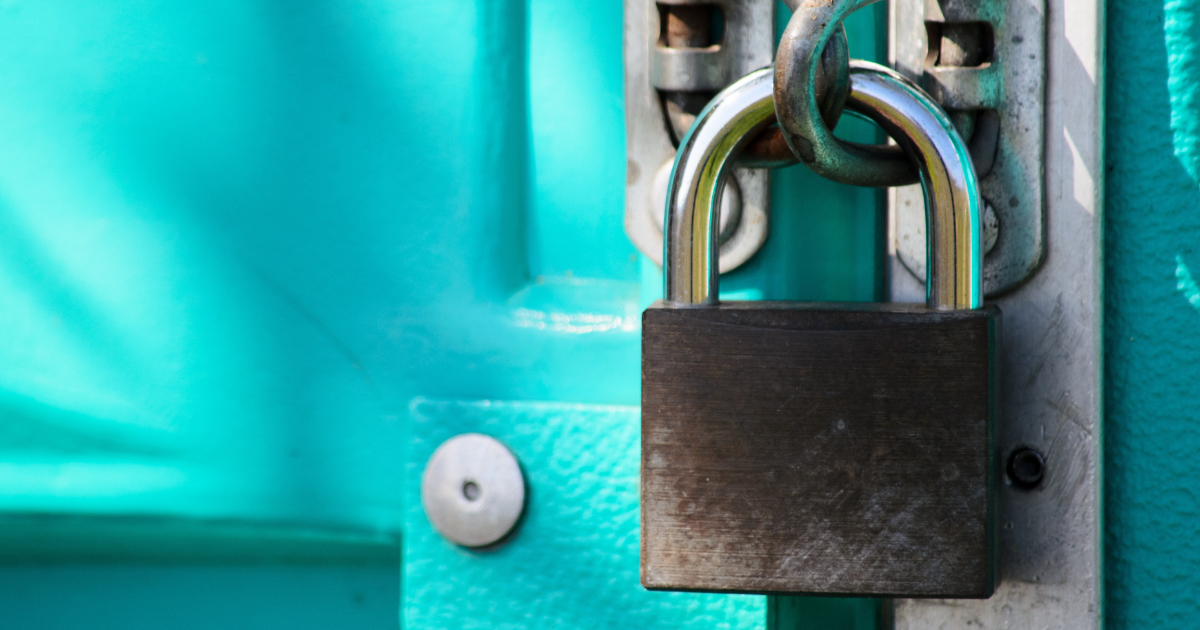 Image of a padlock on a blue door