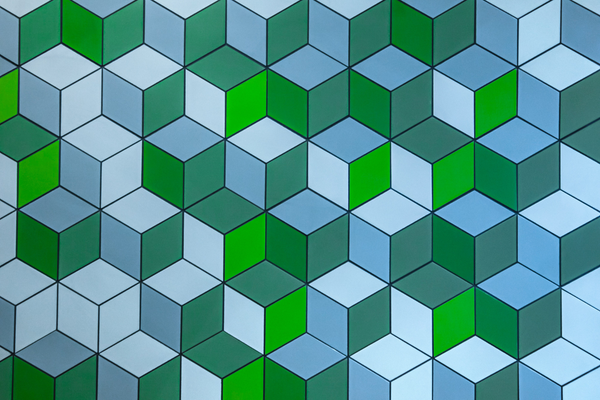 Abstract background of geometric blocks in green and blue shades